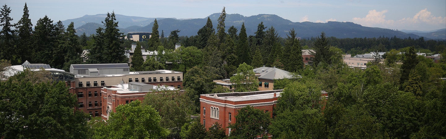aerial view of campus with chapman hall in foreground and mountains in background