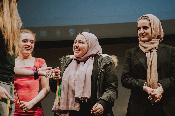 Student at a Forensics Event receiving a medal.