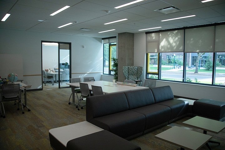 an empty lounge to be used by an academic residential community, with an advisor office adjacent