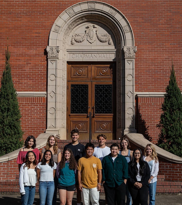group photo of the 2023 peer mentors standing on chapman hall steps