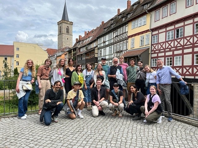 chc study abroad program group shot in berlin, in front of traditional buildings on cobblestone
