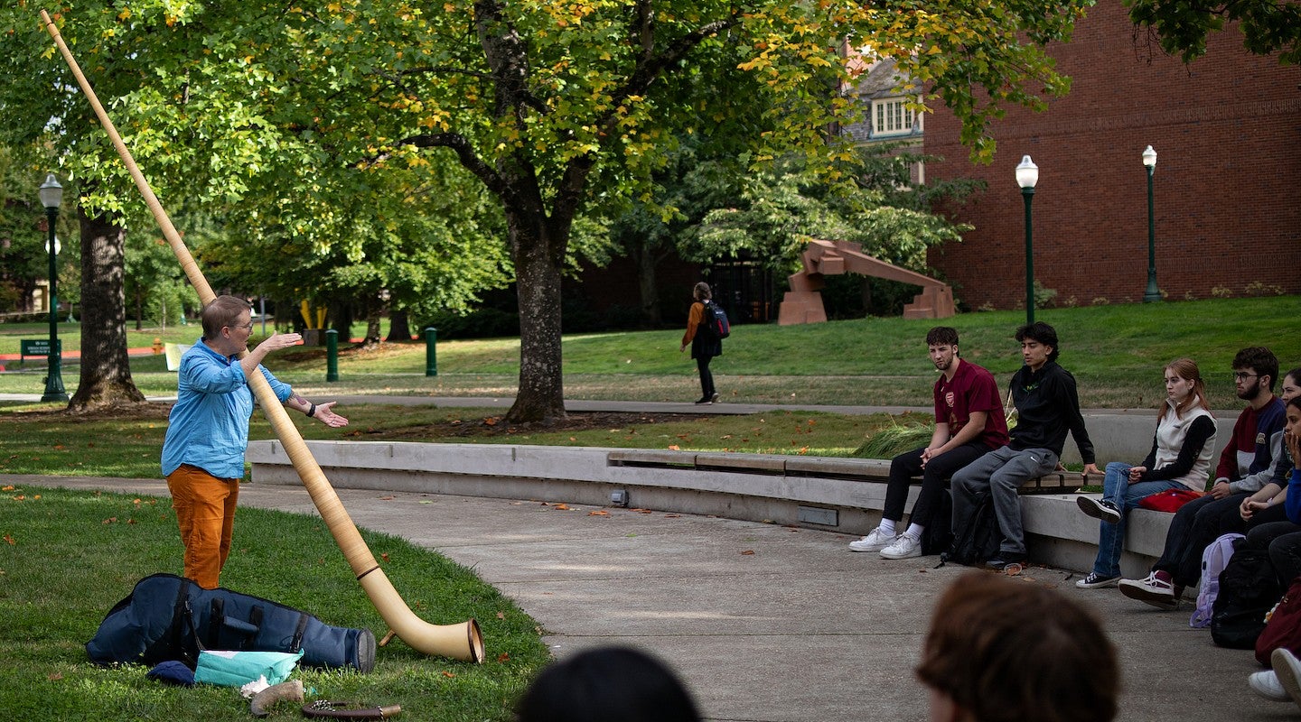 lydia van dreel teaching class on tykeson lawn with alpenhorn