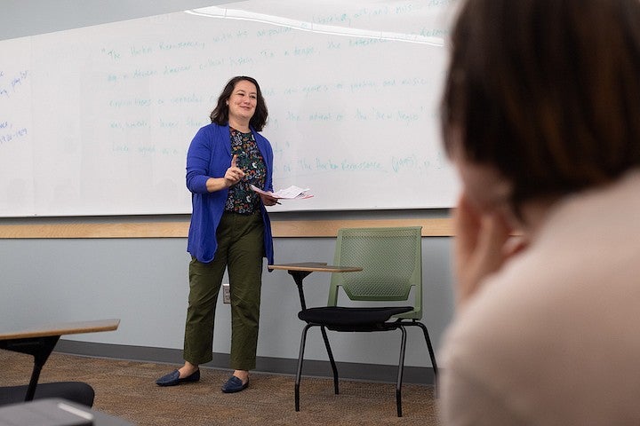 courtney thorsson gesturing while teaching in a classroom