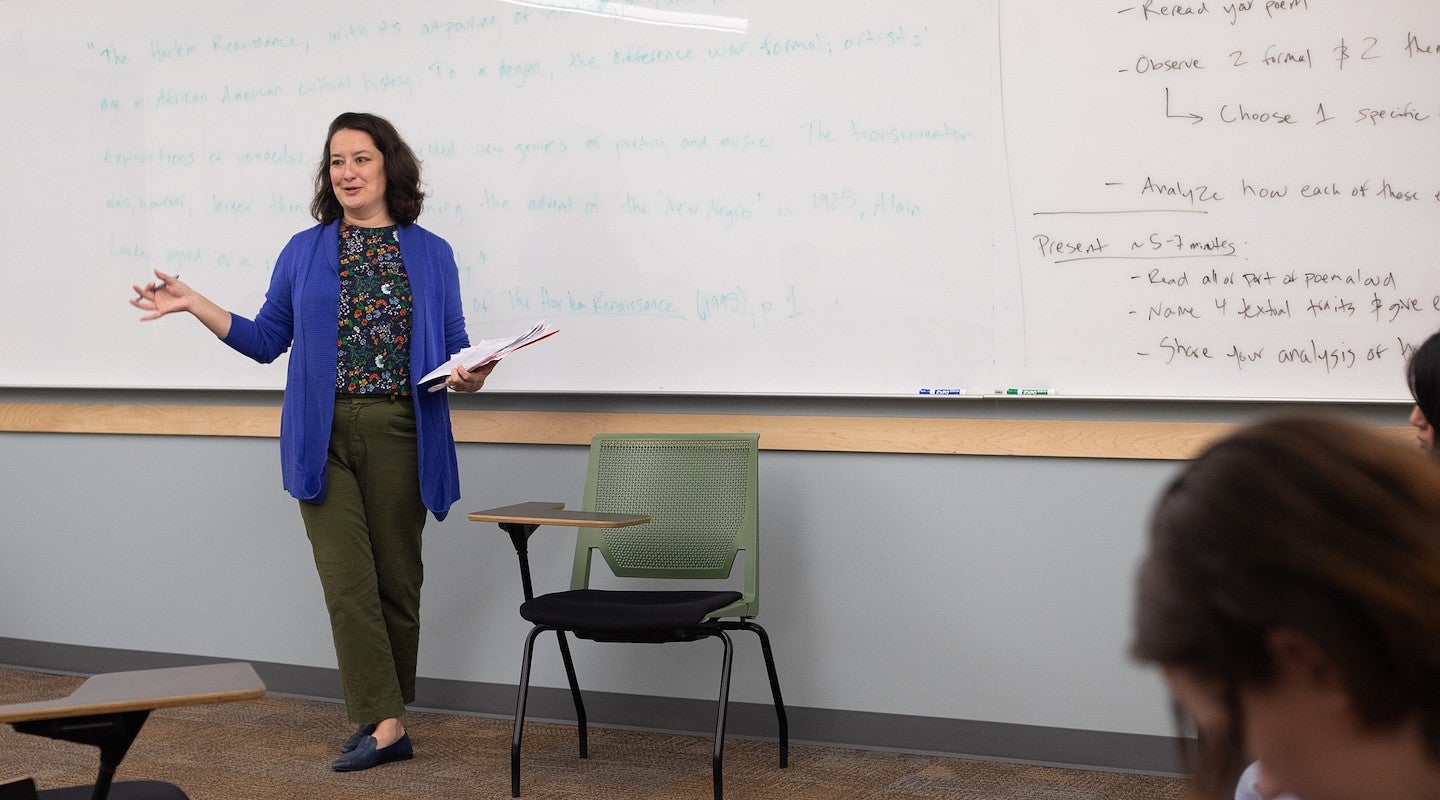 courtney thorsson gesturing while teaching in a classroom