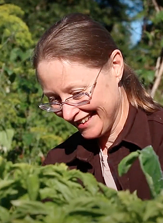 elin england smiling while gardening