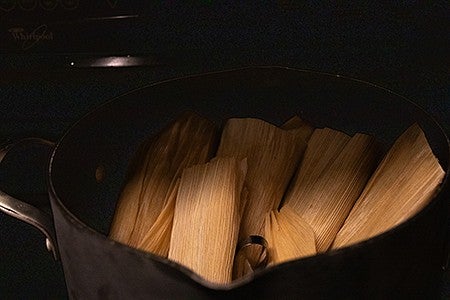 tamales ready to steam in a pot