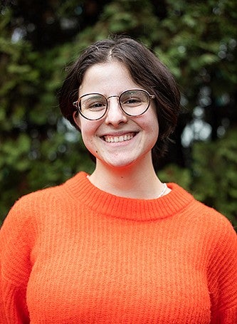 headshot of sofia rodriguez baquero with leafy background