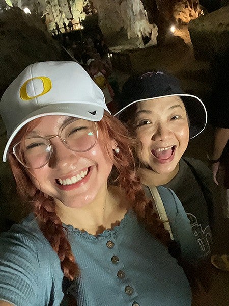 dante and her mother taking a selfie in a cave in vietnam