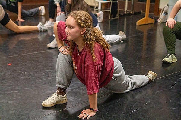 sierra hawes stretching in a lunge at dance practice