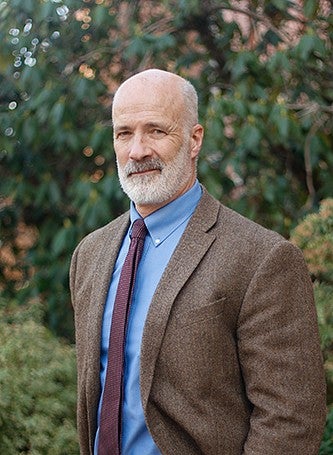 rob cloutier portrait with bushes in background