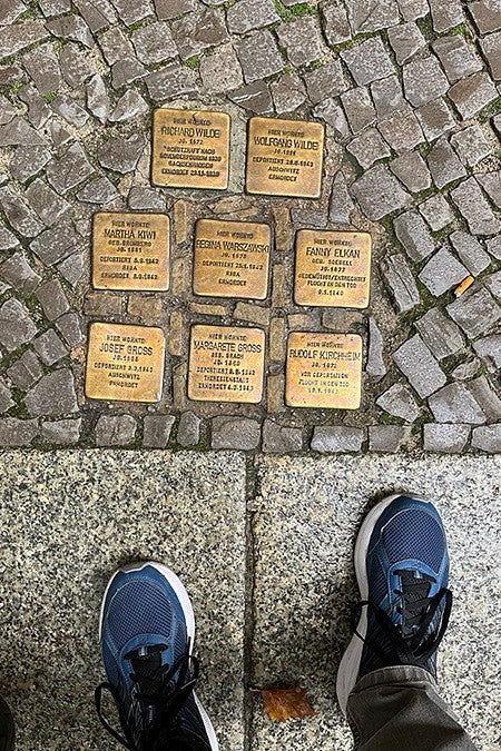 brass cobblestones set among other cobblestones identifying holocaust victims in a german street