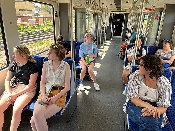 students riding the city train in berlin