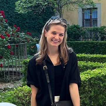 portrait of rachel benner in courtyard