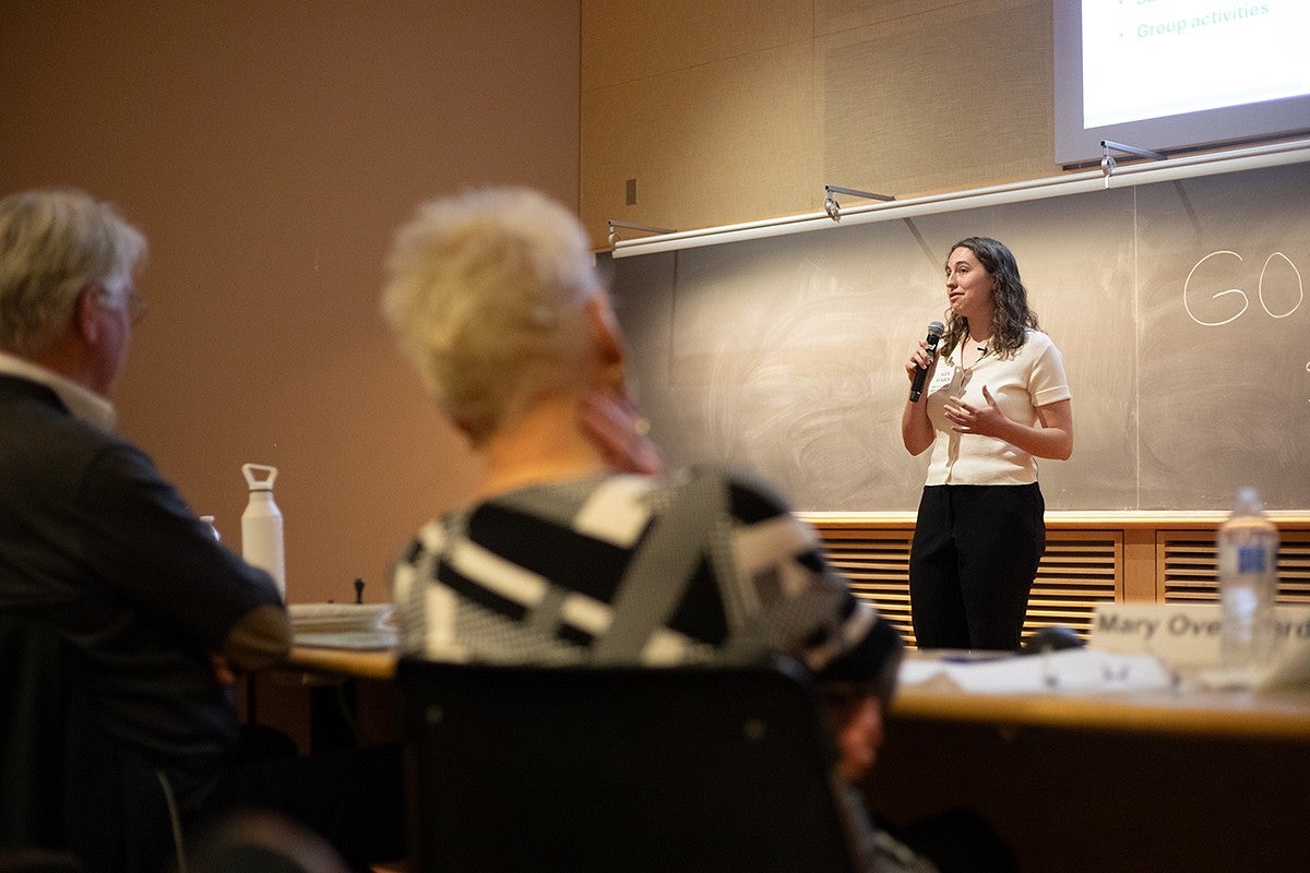 student presenting in front of audience