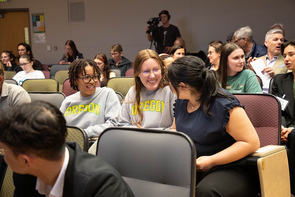 competitor laughing with friends in audience