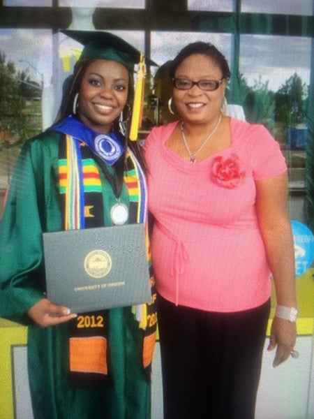 ann oluloro poses with her mother at her graduation from CHC