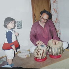 young gayatri misra with dad playing tabla