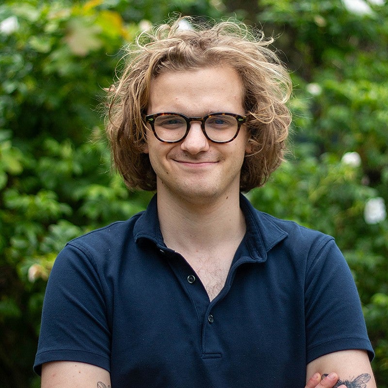 portrait of elias roessler with leafy background