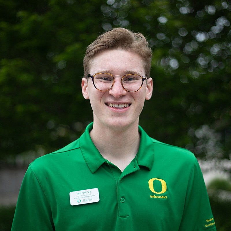 portrait of garrett raver with leafy background