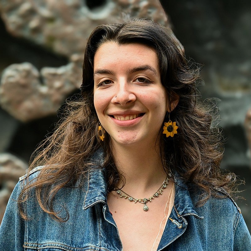 portrait of sarah wittmann in front of metal sculpture