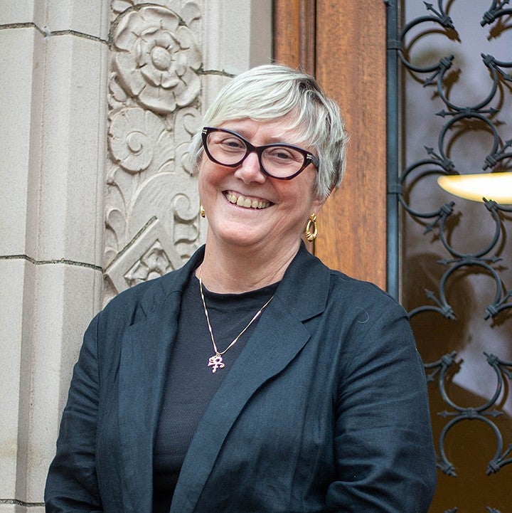 portrait of dean carol stabile outside chapman front door