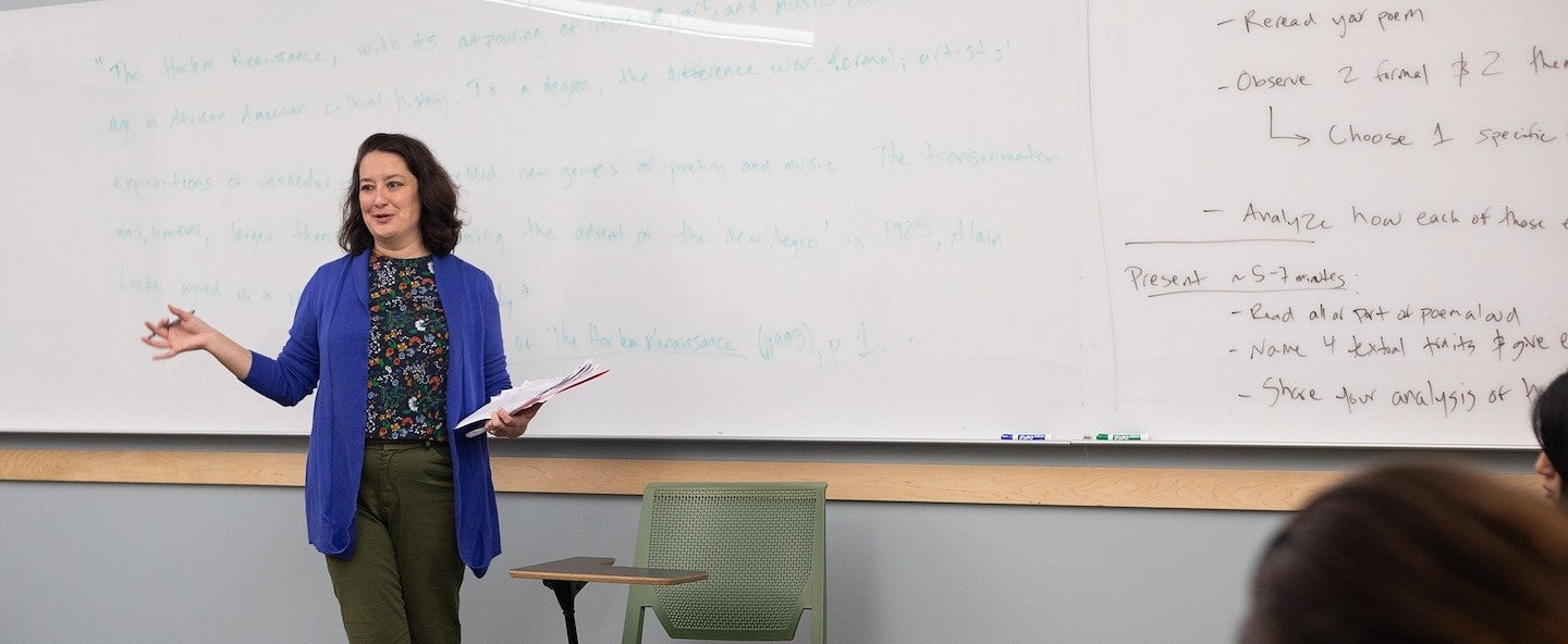 courtney thorsson gesturing while teaching in a classroom