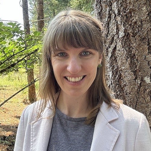 headshot of kristen rahilly in forest