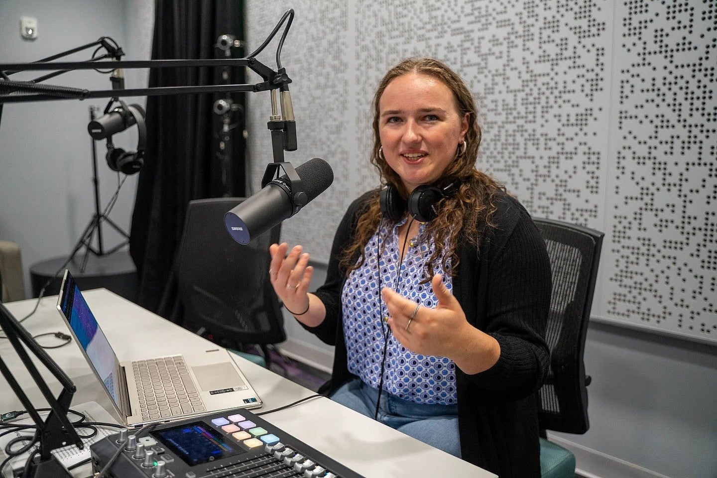 portrait of erin morrison seated in an audio booth