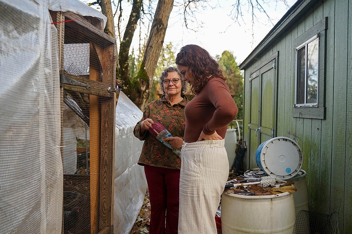 nika bartoo smith with her grandmother at a backyard chicken coop