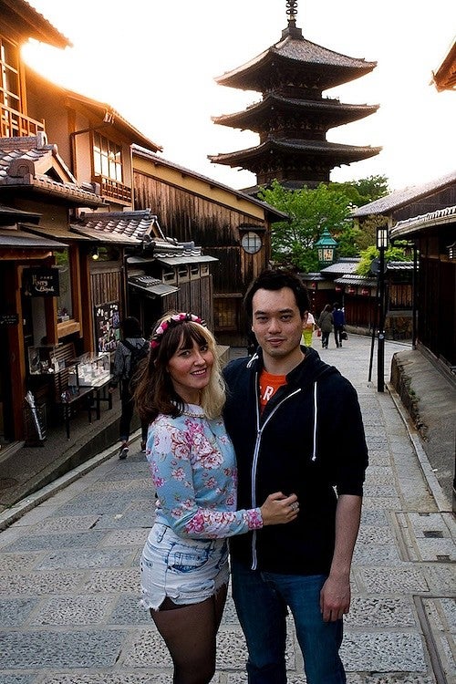 natalie jacobsen and her husband Max in japan, posing in a quaint street