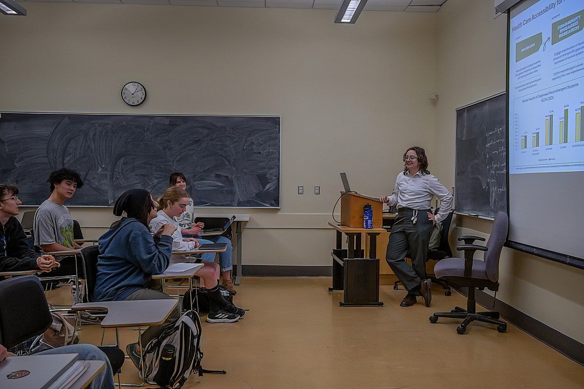 student presenting powerpoint to classroom