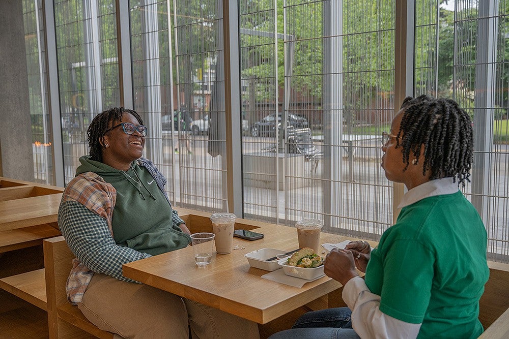 two people having lunch in a campus cafe