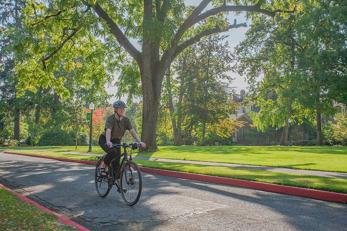 larissa stiglich rifding her bike through campus