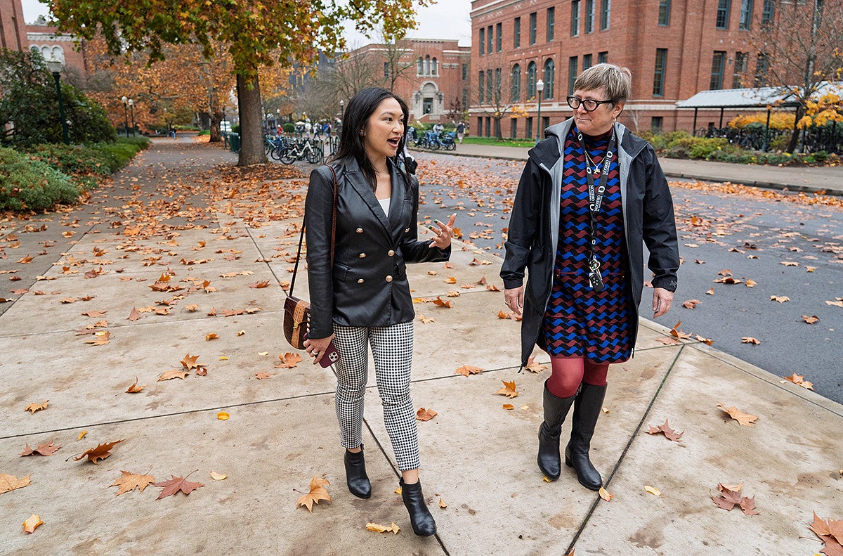 lorie acio and carol stabile strolling down 13th avenue among crunchy leaves
