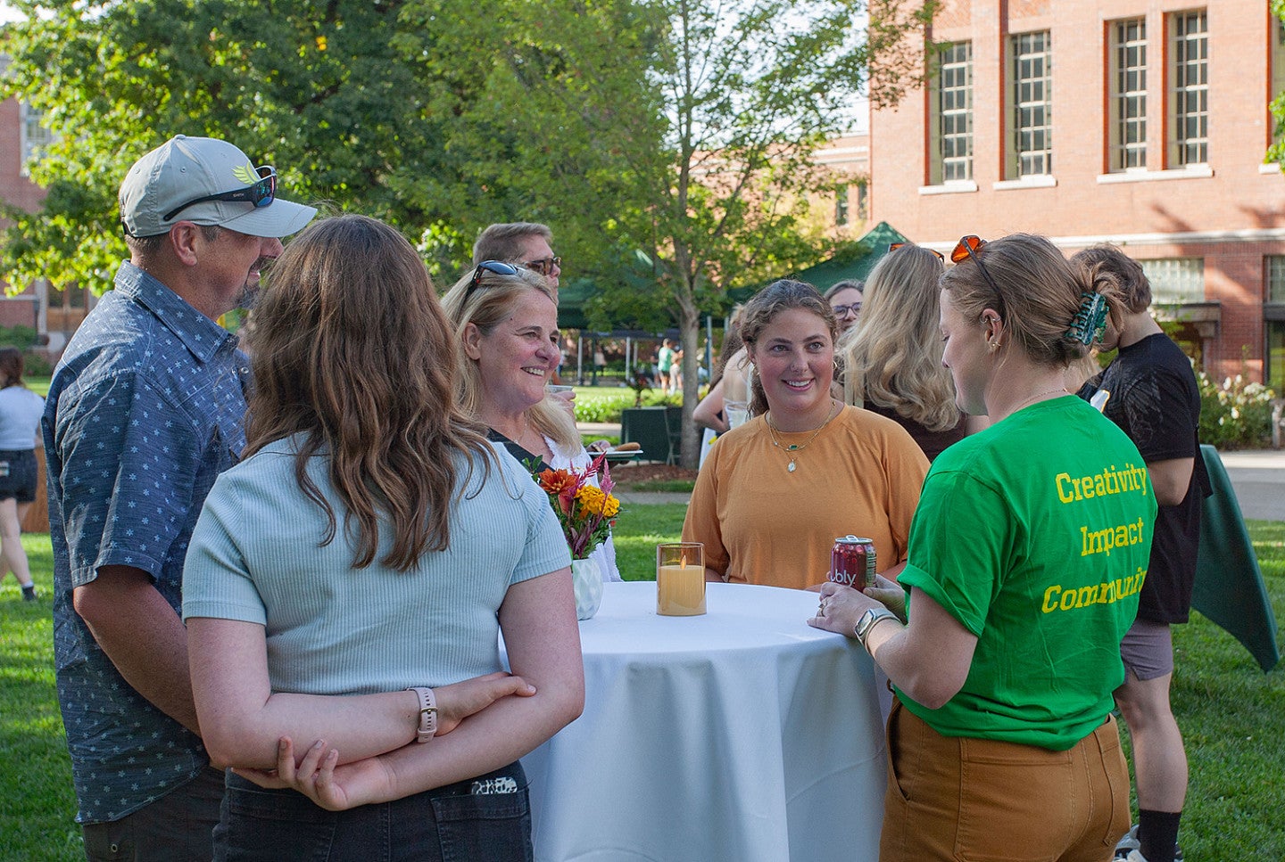 new students, family members and chc faculty interacting at an outdoor reception