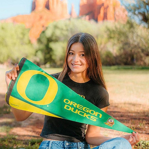 coco zuniga portrait with ducks pennant