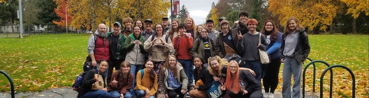 group of students on the debate team posing outside on the university of puget sound campus