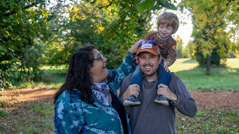 Jesse Wilson with wife and son