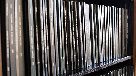 Thesis books on a shelf