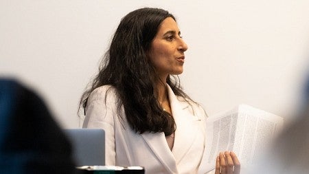 Anita Chari teaching at front of classroom