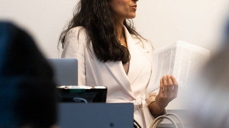 Anita Chari teaching at front of classroom