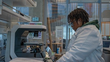 student at lab bench