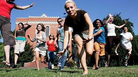 Students running on a lawn