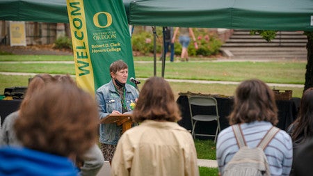 Interim Dean Carol Stabile addresses the collection of second-year CHC students. 