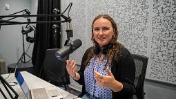 portrait of erin morrison seated in an audio booth