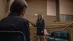 student practicing for mock trial in lecture hall