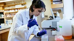 amelia kotamarti using a pipette at a lab bench