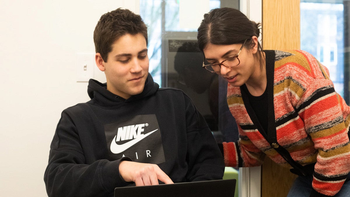 Angela Rovak (right) advising a student (left).