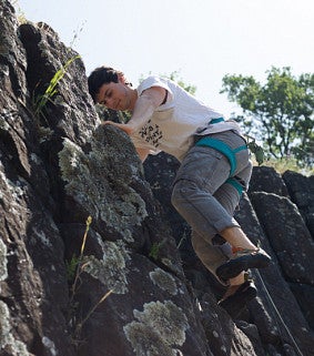 Aaron Georis (2023) rock climbing.