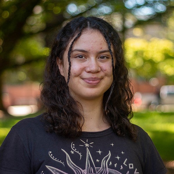 portrait of Neive Wellington with trees in background